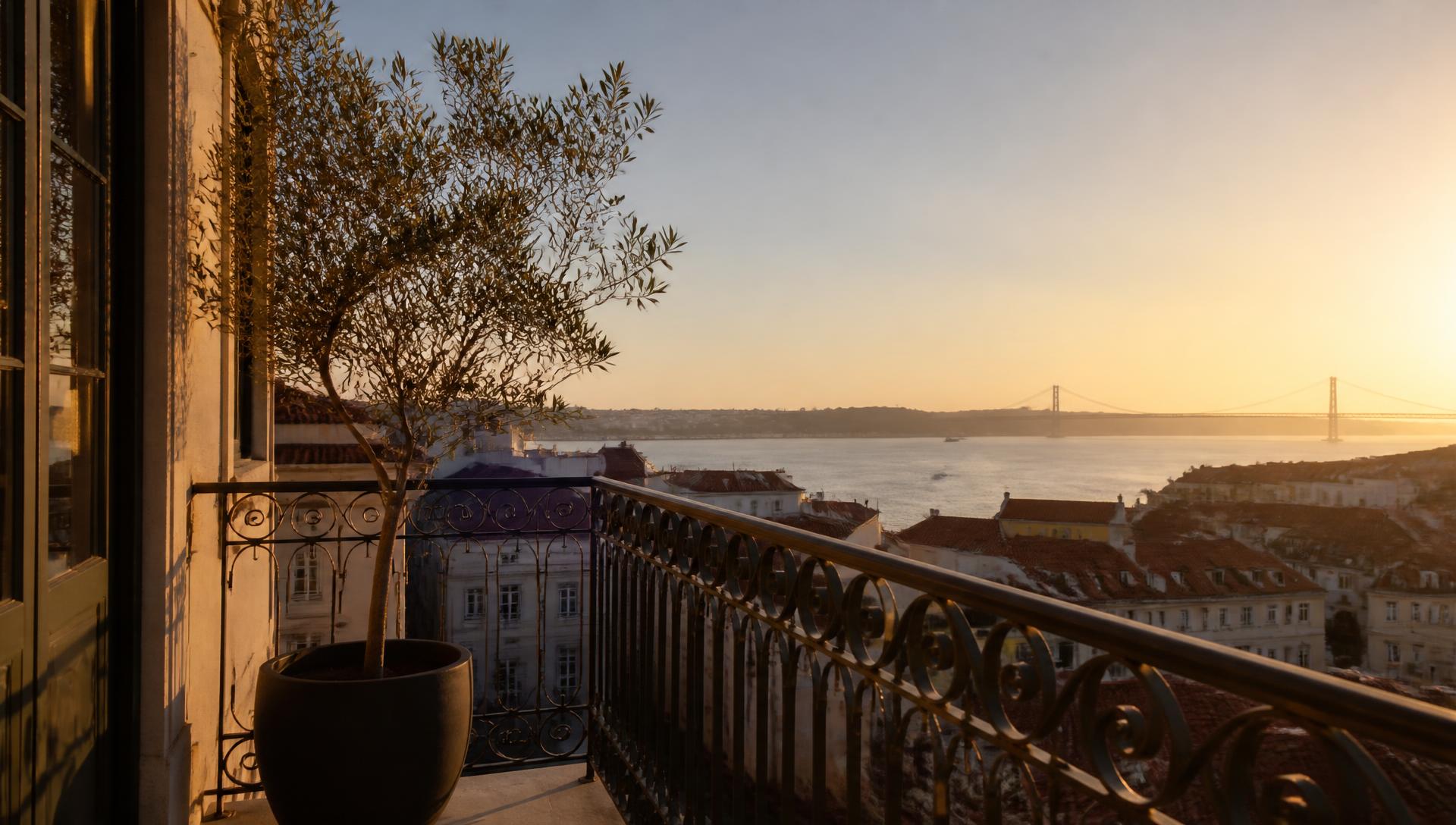 Balcony of a Lisbon apartment overlooking the Tagus river at golden hour